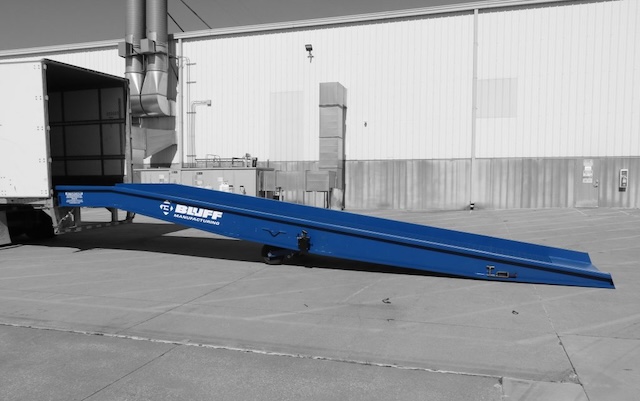 The Bluff CORE model portable yard ramp positioned at the back end of a container truck.